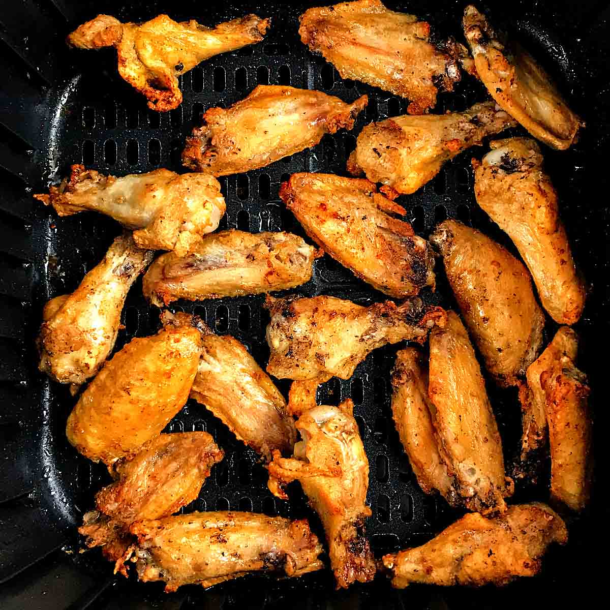 Frozen Chicken wings in air fryer.