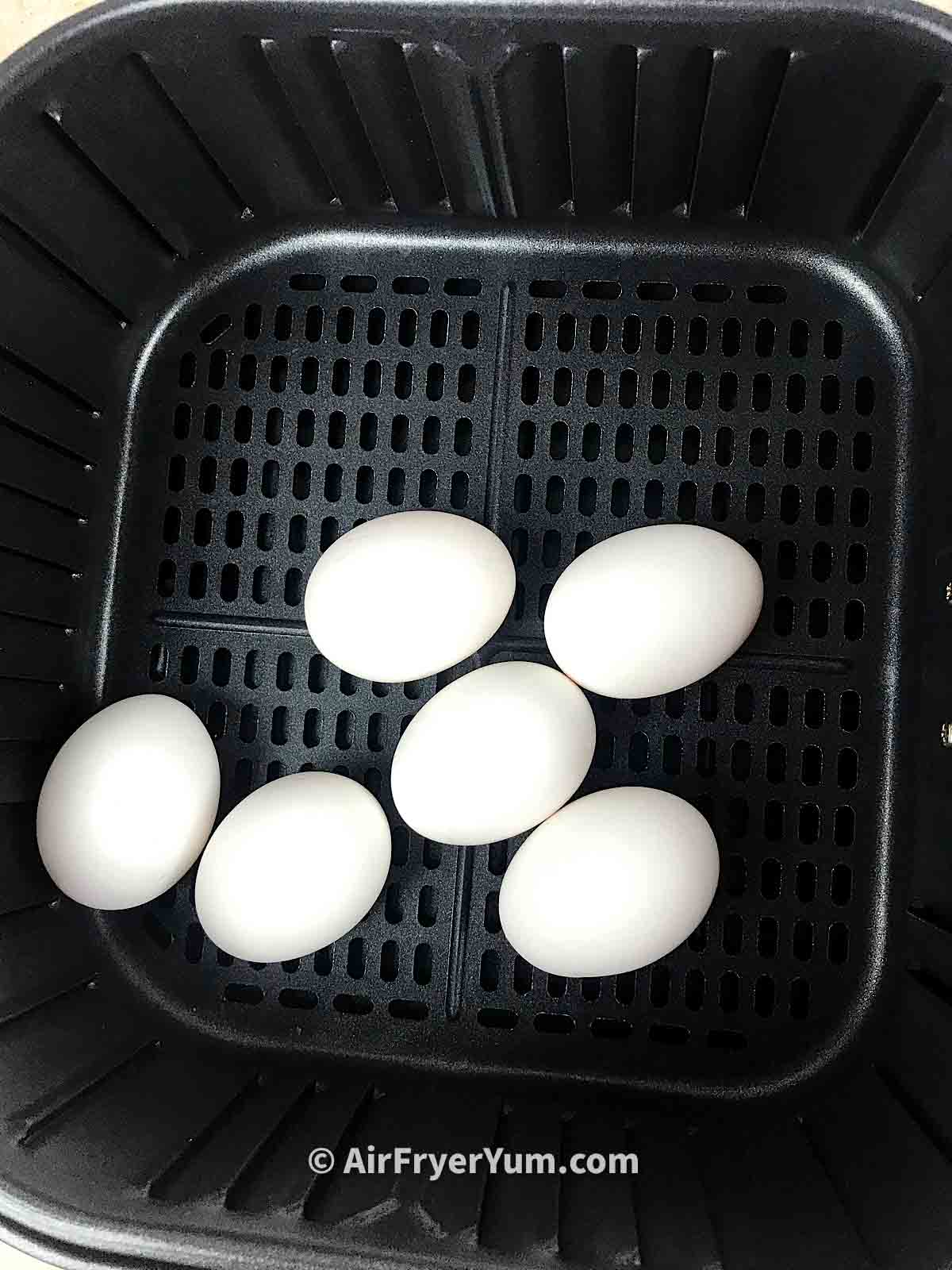 White eggs in air fryer basket